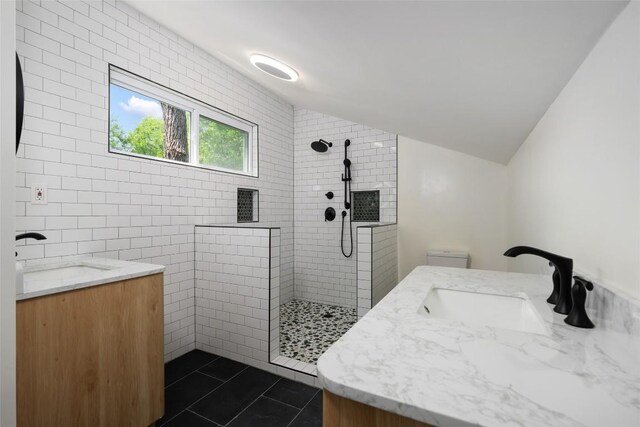 5902 Tumbling Cir, Austin, TX 78731 - full bathroom featuring vanity, walk in shower, tile patterned flooring, and vaulted ceiling