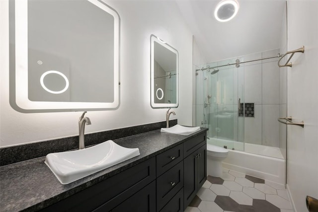 5902 Tumbling Cir, Austin, TX 78731 - bathroom featuring double vanity, enclosed tub / shower combo, and tile patterned flooring