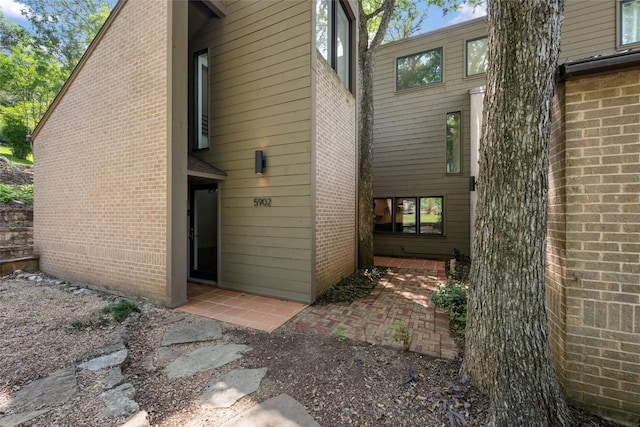 5902 Tumbling Cir, Austin, TX 78731 - rear view of property with brick siding