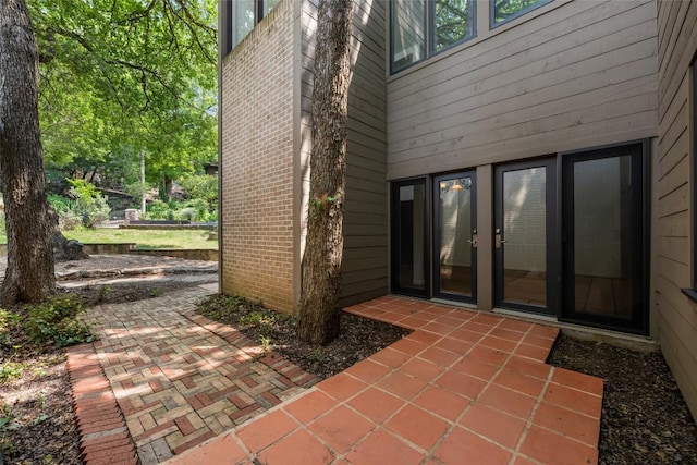 5902 Tumbling Cir, Austin, TX 78731 - property entrance featuring a patio area and brick siding