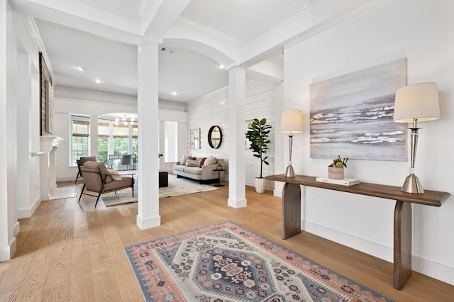 10239 Scull Creek Dr, Austin, TX 78730 - entryway with decorative columns, crown molding, light wood finished floors, recessed lighting, and a chandelier