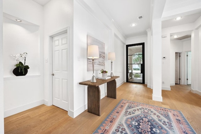 10239 Scull Creek Dr, Austin, TX 78730 - entryway with light wood-style floors, ornamental molding, and recessed lighting