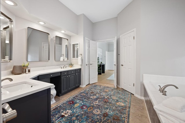 10239 Scull Creek Dr, Austin, TX 78730 - full bath with vanity, a bath, tile patterned floors, and recessed lighting