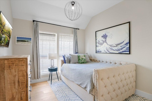 10239 Scull Creek Dr, Austin, TX 78730 - bedroom with vaulted ceiling and light wood-style floors