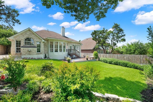 10239 Scull Creek Dr, Austin, TX 78730 - rear view of house with a chimney, a patio area, and stone siding