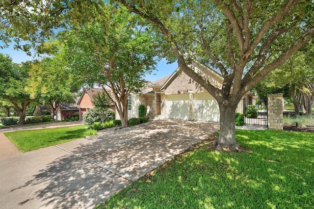 10239 Scull Creek Dr, Austin, TX 78730 - view of property hidden behind natural elements featuring driveway, an attached garage, and a front lawn