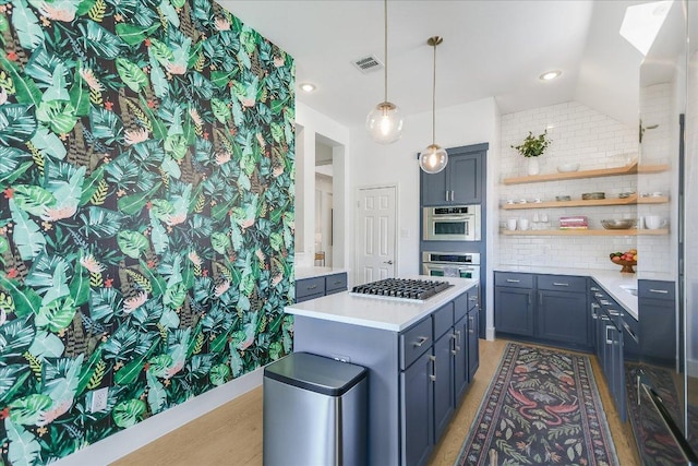 10239 Scull Creek Dr, Austin, TX 78730 - kitchen with open shelves, backsplash, stainless steel gas stovetop, light countertops, and hanging light fixtures