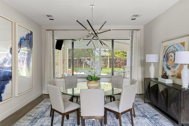 3604 Shady Creek Cv, Austin, TX 78746 - dining space with a chandelier and wood finished floors