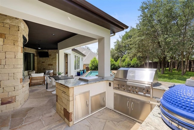 3604 Shady Creek Cv, Austin, TX 78746 - view of patio featuring an outdoor kitchen and an outdoor bar