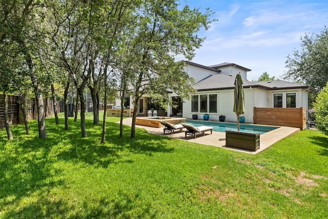 3604 Shady Creek Cv, Austin, TX 78746 - rear view of property with a patio, an outdoor pool, stucco siding, and a shingled roof