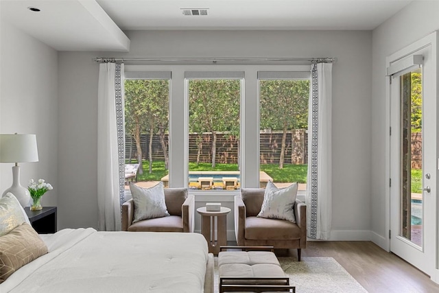 3604 Shady Creek Cv, Austin, TX 78746 - bedroom featuring access to exterior and wood finished floors