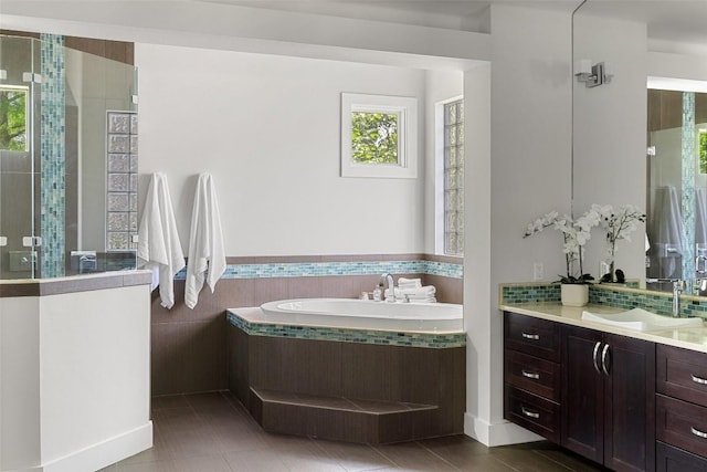 3604 Shady Creek Cv, Austin, TX 78746 - bathroom with a bath, a tile shower, vanity, and tile patterned floors