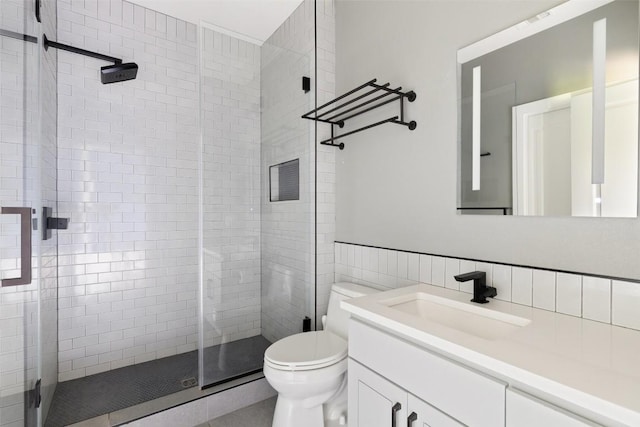 3604 Shady Creek Cv, Austin, TX 78746 - bathroom featuring vanity, a shower stall, and tile walls