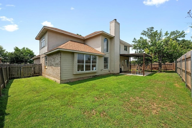 122 Retama Dr, Georgetown, TX 78626 - back of property featuring a chimney, a patio, and brick siding