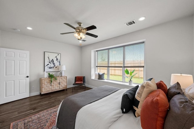 122 Retama Dr, Georgetown, TX 78626 - bedroom with wood finished floors, baseboards, recessed lighting, and ceiling fan