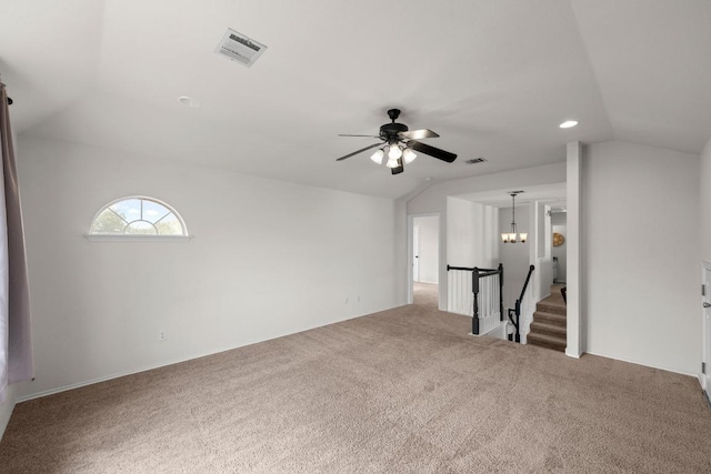 122 Retama Dr, Georgetown, TX 78626 - unfurnished living room with vaulted ceiling, carpet flooring, and ceiling fan