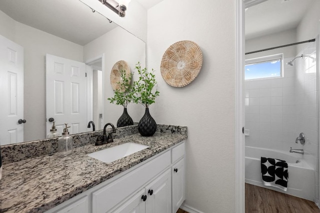 122 Retama Dr, Georgetown, TX 78626 - full bath with vanity, bathtub / shower combination, wood finished floors, and baseboards