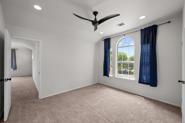 122 Retama Dr, Georgetown, TX 78626 - unfurnished room with carpet flooring, ceiling fan, baseboards, vaulted ceiling, and recessed lighting