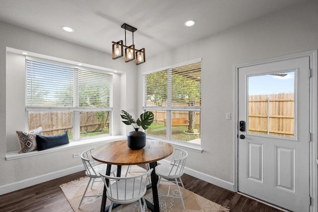 122 Retama Dr, Georgetown, TX 78626 - dining space featuring baseboards, wood finished floors, and recessed lighting