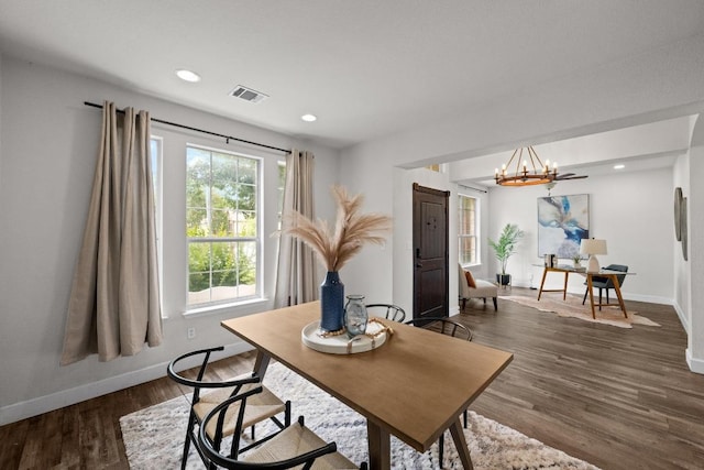 122 Retama Dr, Georgetown, TX 78626 - dining room featuring a chandelier, baseboards, dark wood-style flooring, and recessed lighting