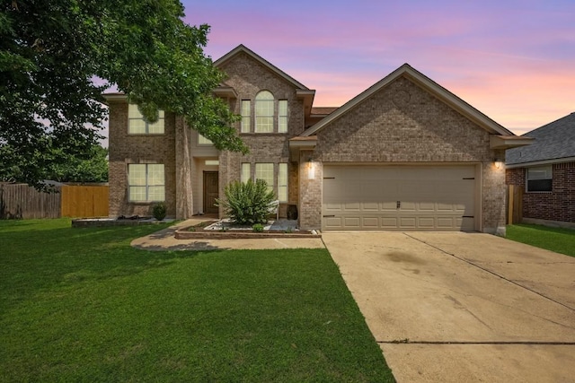 122 Retama Dr, Georgetown, TX 78626 - traditional home featuring a garage, brick siding, and driveway