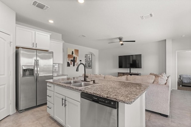609 Ibis Falls Loop, Jarrell, TX 76537 - kitchen featuring appliances with stainless steel finishes, a sink, a kitchen island with sink, light tile patterned floors, and recessed lighting
