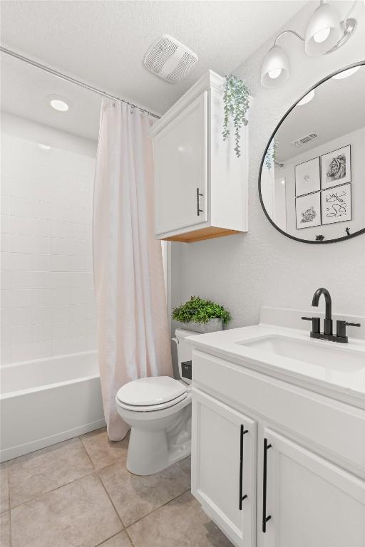609 Ibis Falls Loop, Jarrell, TX 76537 - bathroom featuring vanity, toilet, shower / tub combo, and tile patterned floors