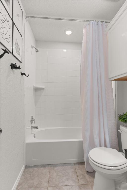 609 Ibis Falls Loop, Jarrell, TX 76537 - full bathroom featuring toilet, shower / bath combo, and tile patterned flooring