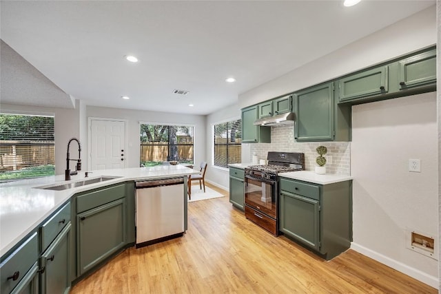 12910 Steeple Chase Dr, Austin, TX 78729 - kitchen featuring black gas range oven, dishwasher, green cabinets, a sink, and recessed lighting