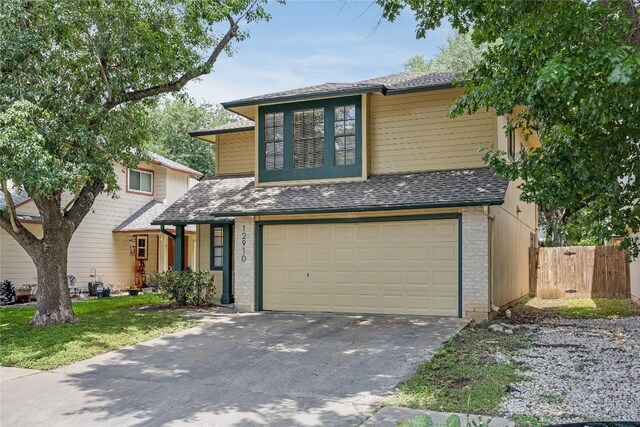 12910 Steeple Chase Dr, Austin, TX 78729 - view of front facade featuring a garage, driveway, brick siding, and a shingled roof