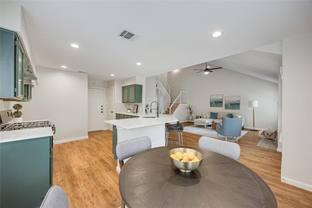 12910 Steeple Chase Dr, Austin, TX 78729 - dining area featuring baseboards, ceiling fan, light wood-style flooring, recessed lighting, and stairs