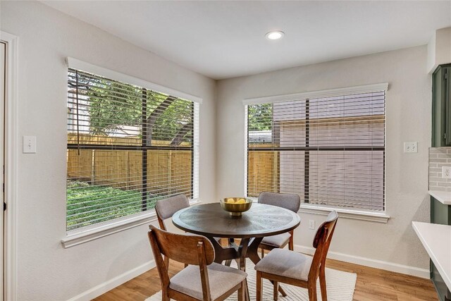 12910 Steeple Chase Dr, Austin, TX 78729 - dining space featuring baseboards, light wood finished floors, and recessed lighting