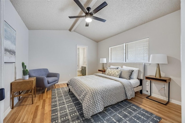 12910 Steeple Chase Dr, Austin, TX 78729 - bedroom with wood finished floors, a textured ceiling, baseboards, ceiling fan, and connected bathroom