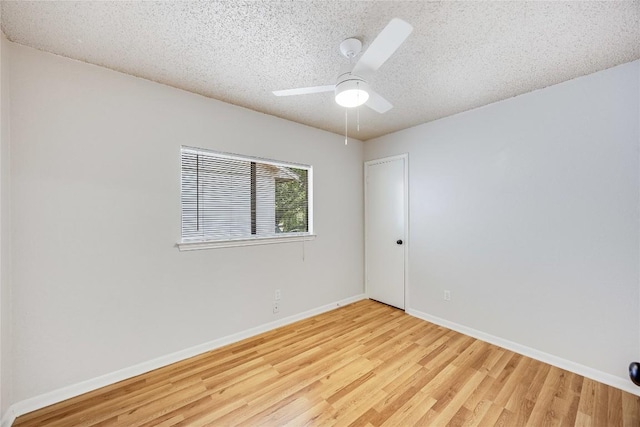 12910 Steeple Chase Dr, Austin, TX 78729 - spare room with light wood-style floors, a textured ceiling, ceiling fan, and baseboards