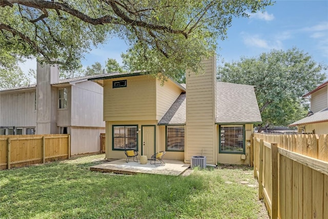 12910 Steeple Chase Dr, Austin, TX 78729 - rear view of property with a chimney, a shingled roof, and a patio area