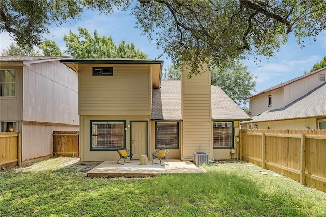 12910 Steeple Chase Dr, Austin, TX 78729 - rear view of property featuring a patio, roof with shingles, central AC, and a chimney