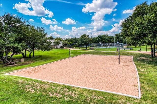 12910 Steeple Chase Dr, Austin, TX 78729 - surrounding community with volleyball court and a lawn