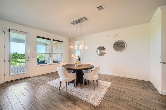 318 Fairway Ridge Rd, Georgetown, TX 78633 - dining room with crown molding, wood finished floors, and baseboards