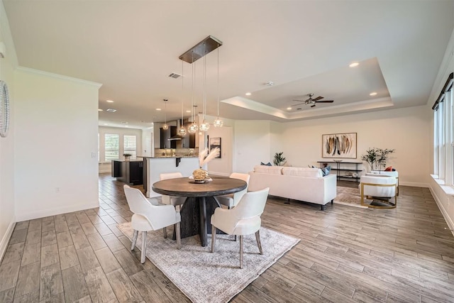 318 Fairway Ridge Rd, Georgetown, TX 78633 - dining area with wood finished floors, ceiling fan, baseboards, recessed lighting, and a raised ceiling