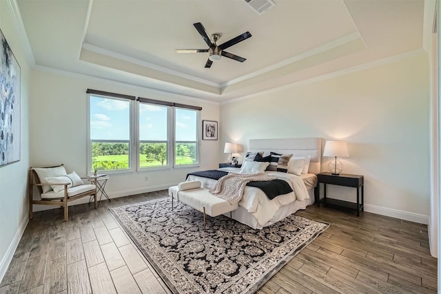 318 Fairway Ridge Rd, Georgetown, TX 78633 - bedroom with a raised ceiling, wood finished floors, baseboards, ornamental molding, and ceiling fan