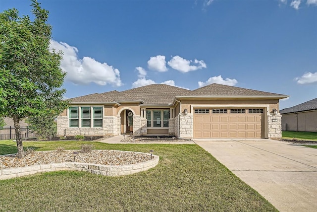 318 Fairway Ridge Rd, Georgetown, TX 78633 - view of front of property featuring stone siding, a garage, concrete driveway, and a front lawn