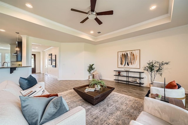 318 Fairway Ridge Rd, Georgetown, TX 78633 - living room with ceiling fan, recessed lighting, ornamental molding, a tray ceiling, and baseboards