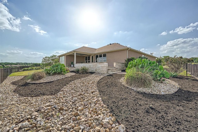 318 Fairway Ridge Rd, Georgetown, TX 78633 - back of house featuring stucco siding and stone siding