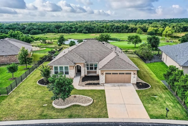 318 Fairway Ridge Rd, Georgetown, TX 78633 - view of front of home with stone siding, driveway, an attached garage, and a shingled roof