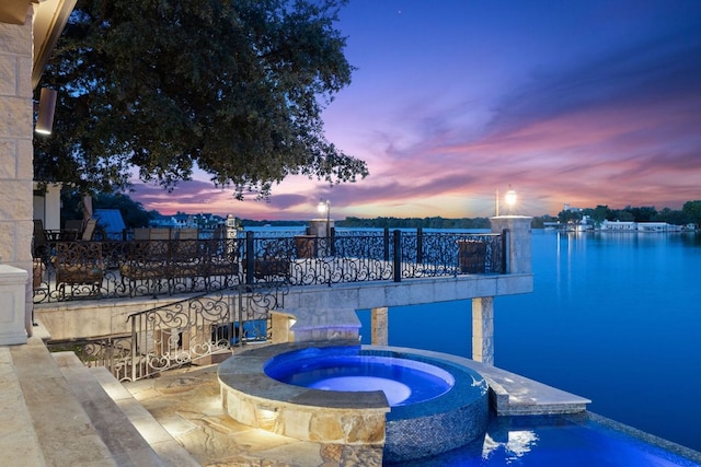 101 Matern Ct, Horseshoe Bay, TX 78657 - view of pool featuring a water view and a pool with connected hot tub