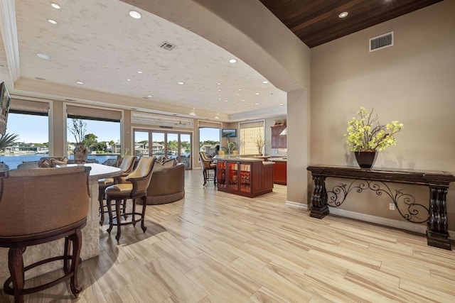 101 Matern Ct, Horseshoe Bay, TX 78657 - dining space featuring recessed lighting, arched walkways, light wood-type flooring, and baseboards