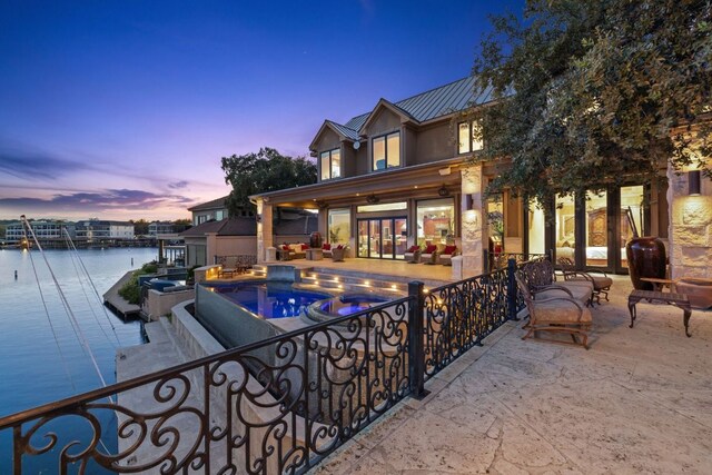 101 Matern Ct, Horseshoe Bay, TX 78657 - swimming pool with an outdoor hangout area, a patio, a water view, a ceiling fan, and a boat dock