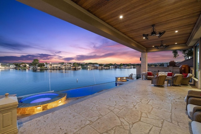 101 Matern Ct, Horseshoe Bay, TX 78657 - view of patio / terrace with a water view and a pool with connected hot tub
