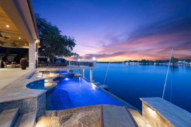 101 Matern Ct, Horseshoe Bay, TX 78657 - view of swimming pool featuring a water view, a pool with connected hot tub, and a patio