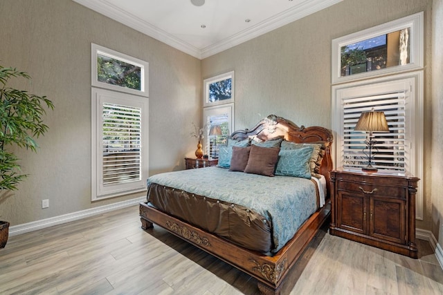 101 Matern Ct, Horseshoe Bay, TX 78657 - bedroom featuring light wood-type flooring, baseboards, and crown molding